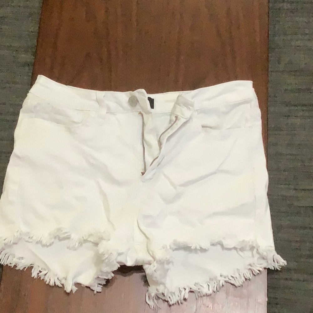 Medium white jean shorts with fringe bottoms